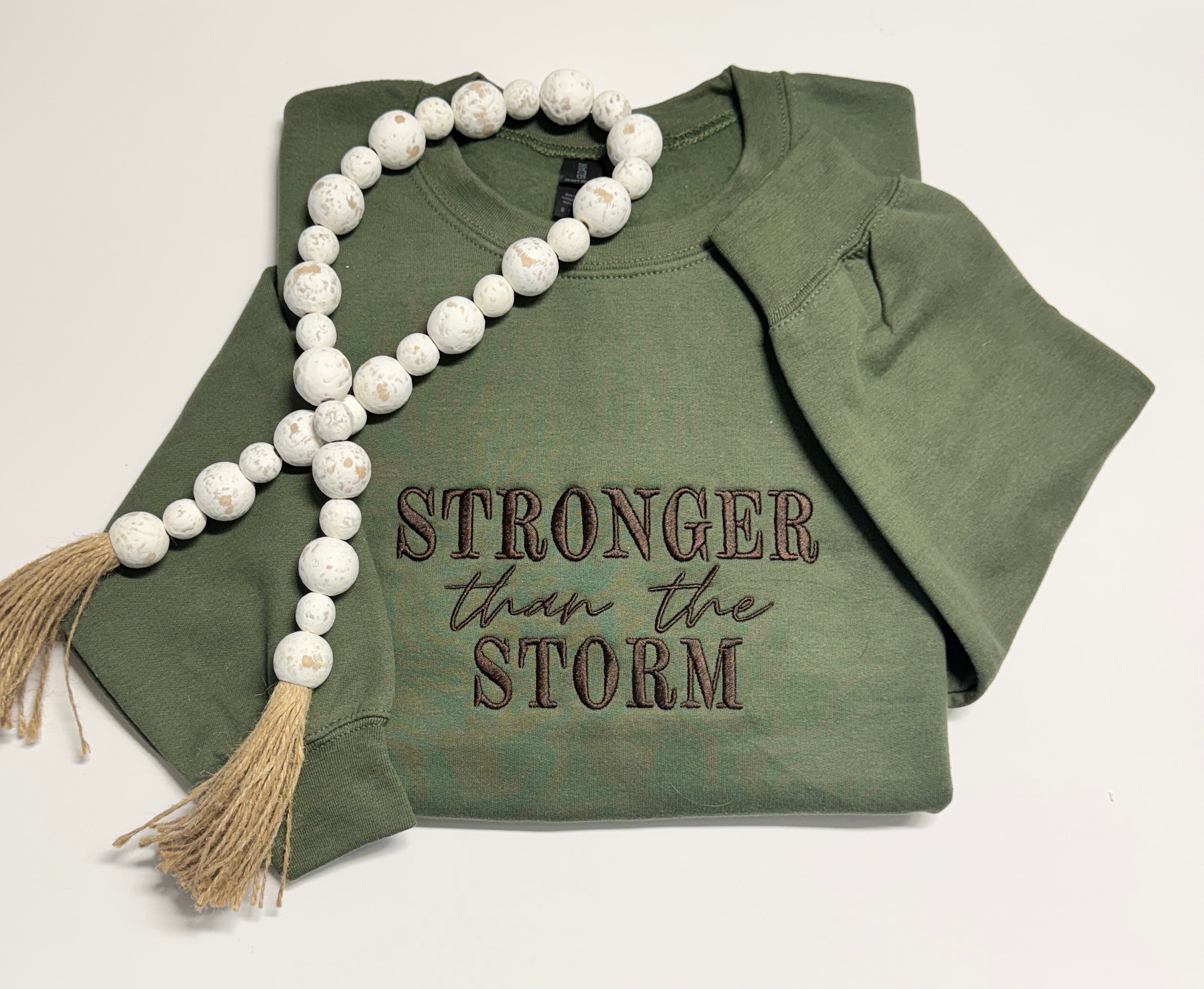 Stronger than the storm crewneck